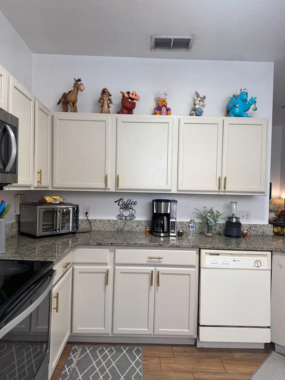 Cream cabinets above and below the coffee corner