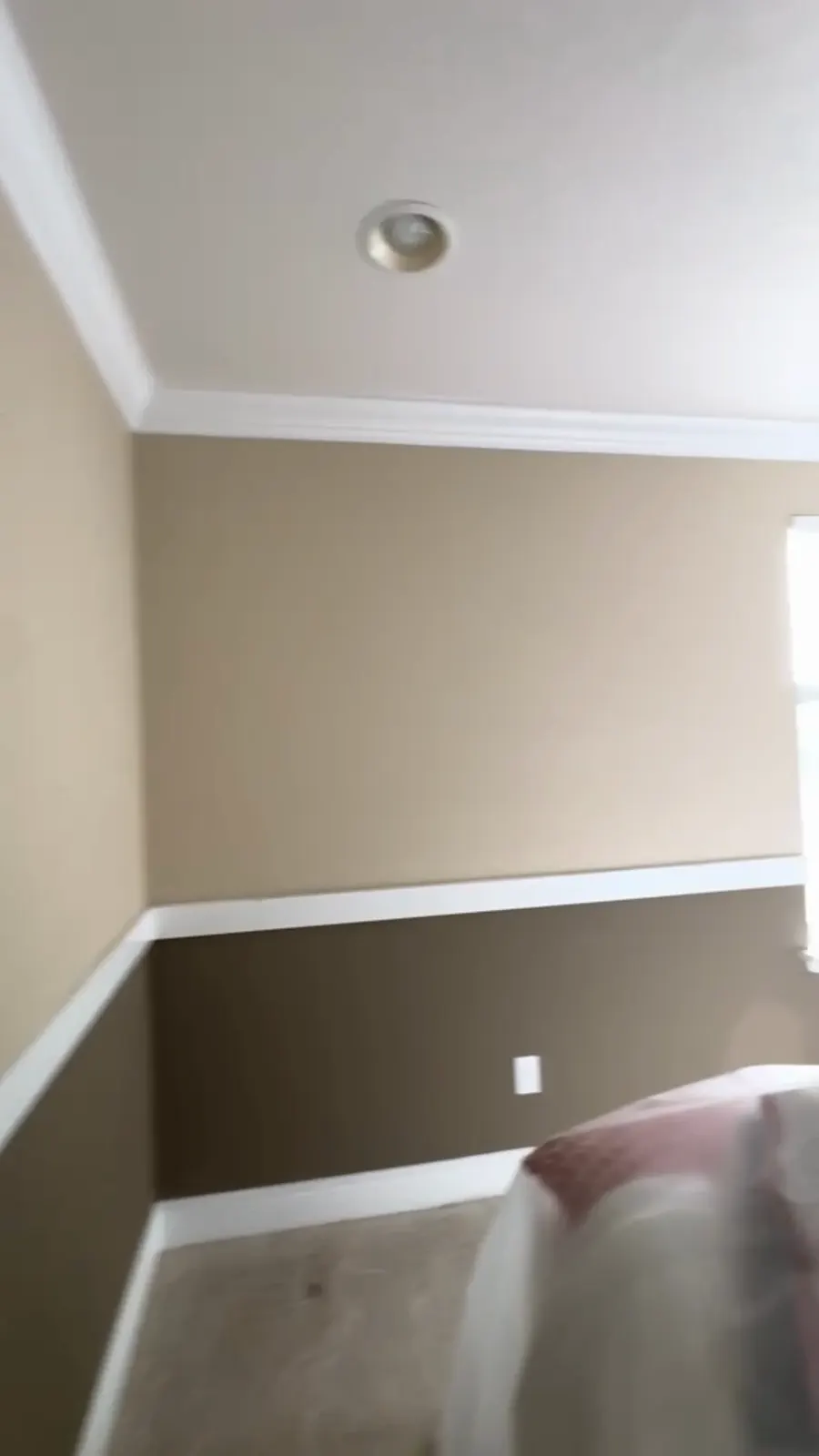 Before: tan walls over a brown band with a white chair rail